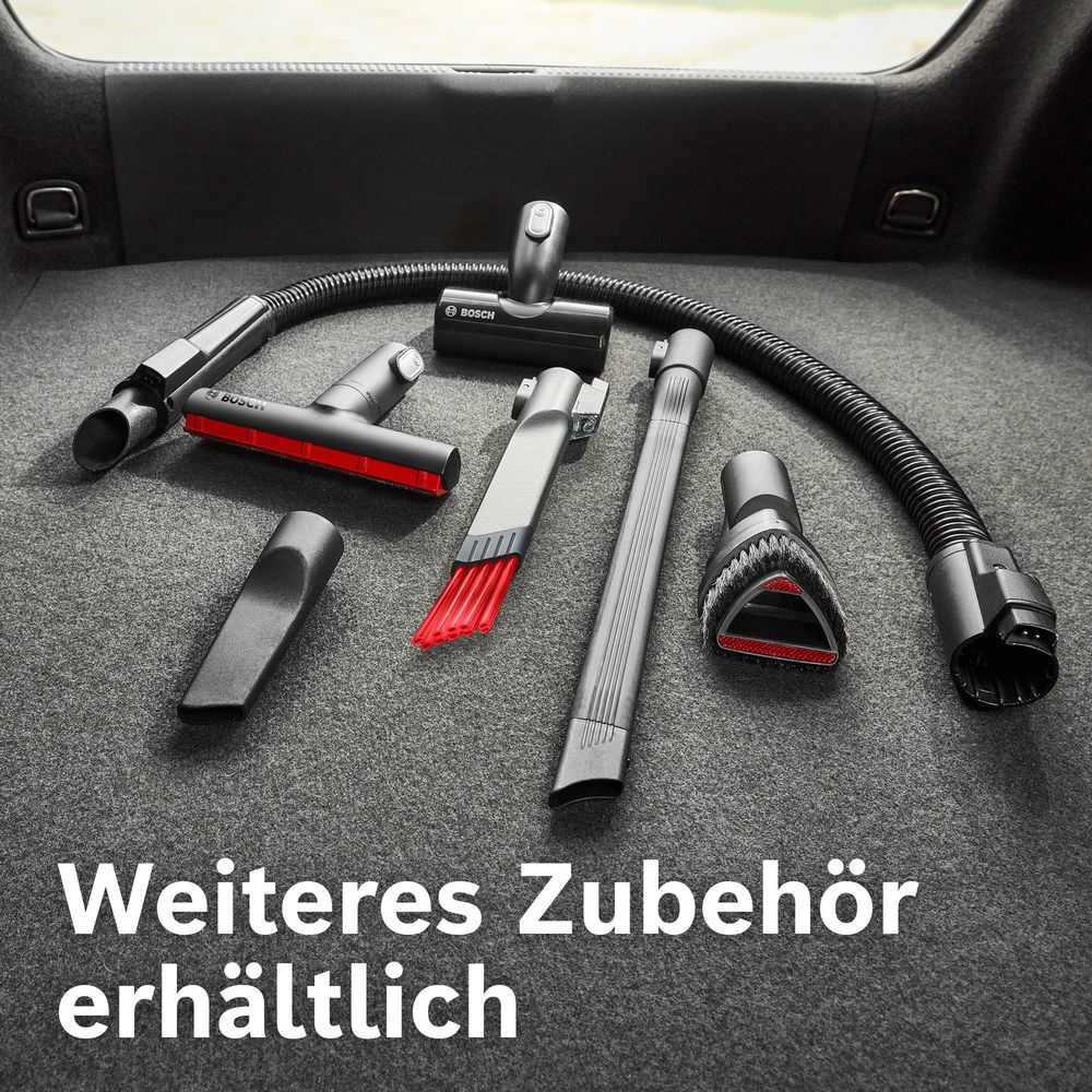 Verschiedenes Bosch Staubsaugerzubehör auf grauem Teppichboden.
