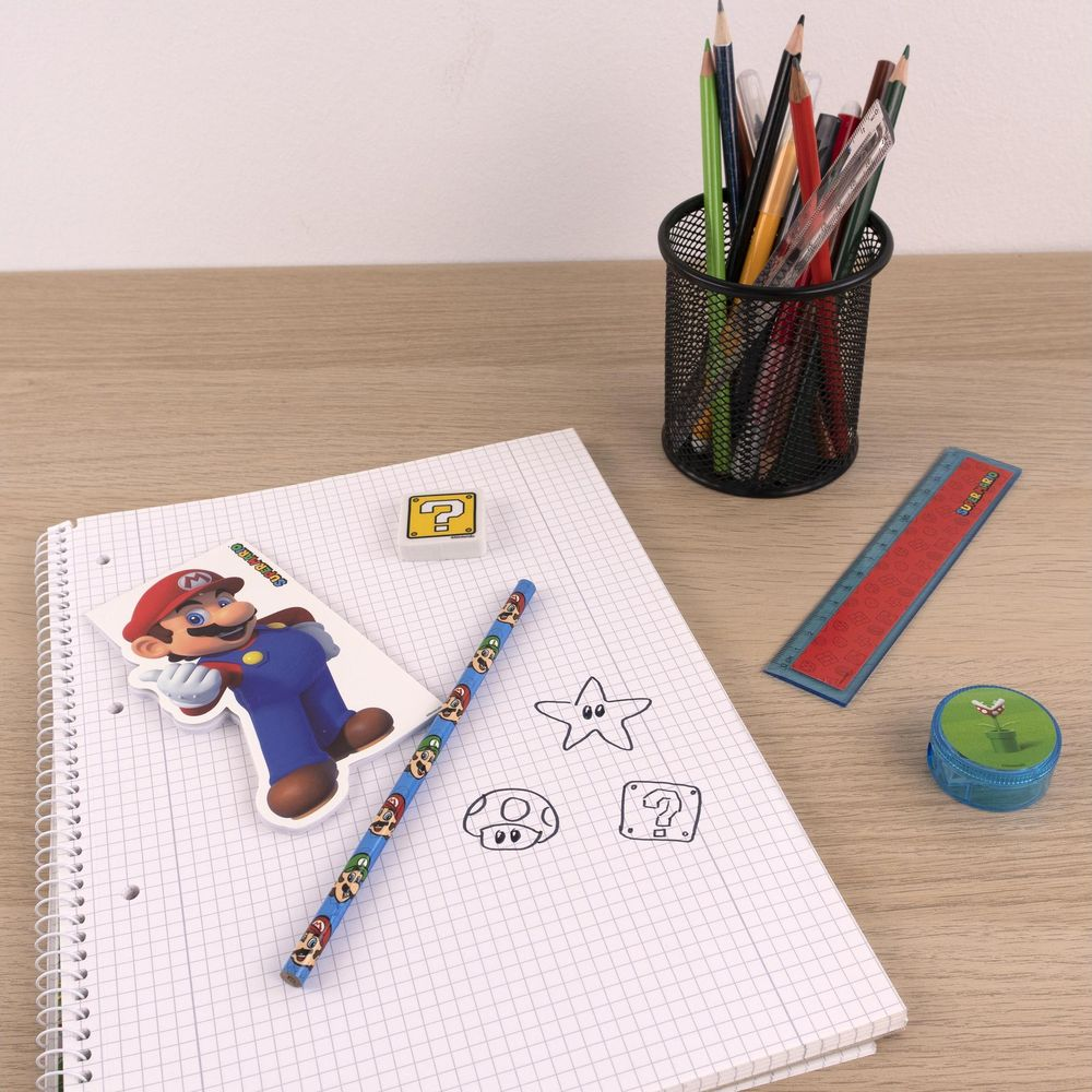 Mario stationery on a gridded notebook with pencils and ruler.