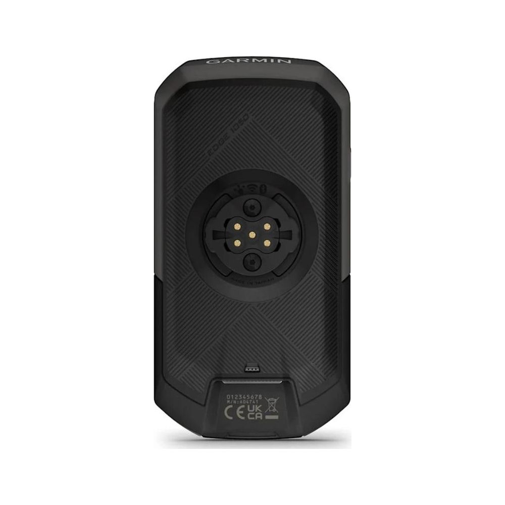 Rückseite eines schwarzen Garmin Edge 1030 Fahrradcomputers mit Ladeanschluss.