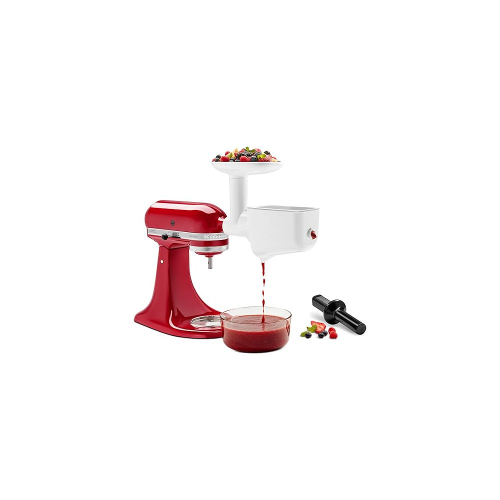 Impastatrice rossa con accessorio spremiagrumi bianco, succo in una ciotola.