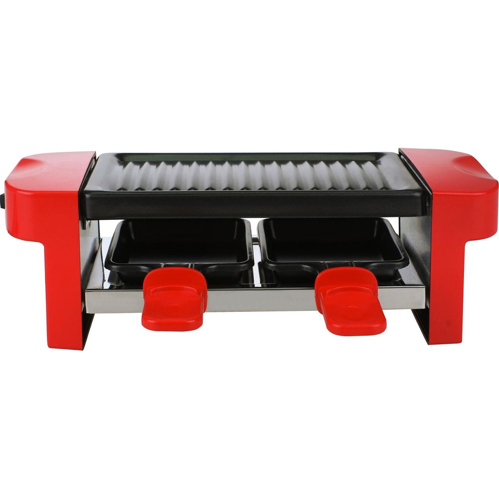 Una griglia raclette rossa con due padelle nere e superficie grill.