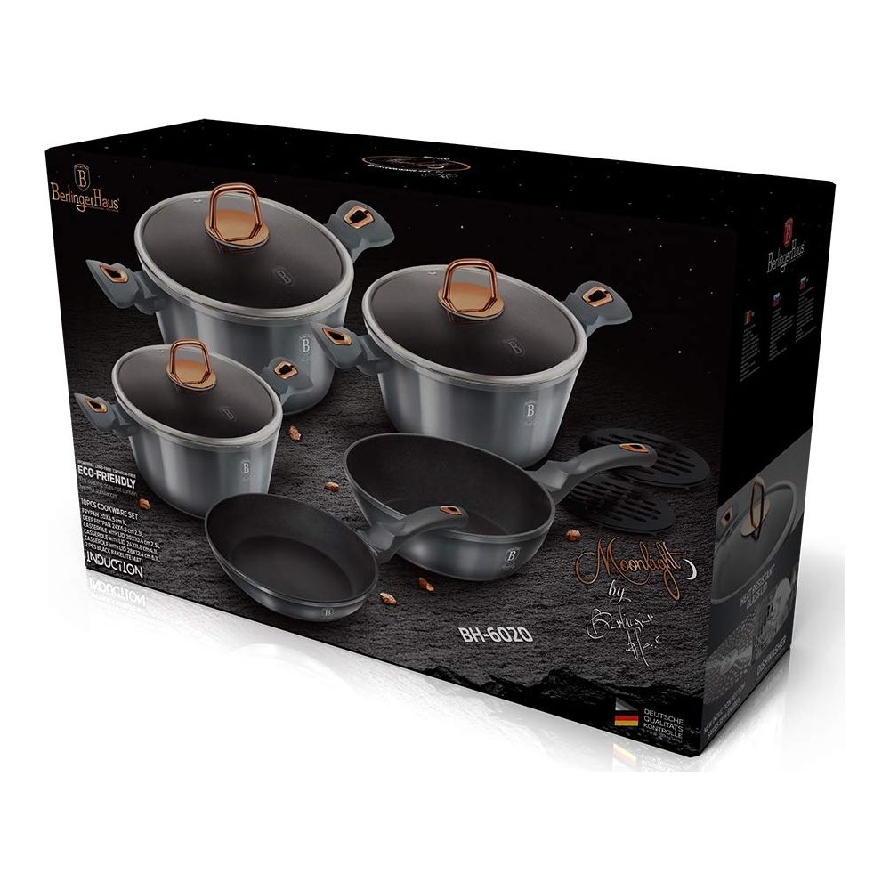 Set de utensilios de cocina con tapas y sartenes en caja negra con estrellas.
