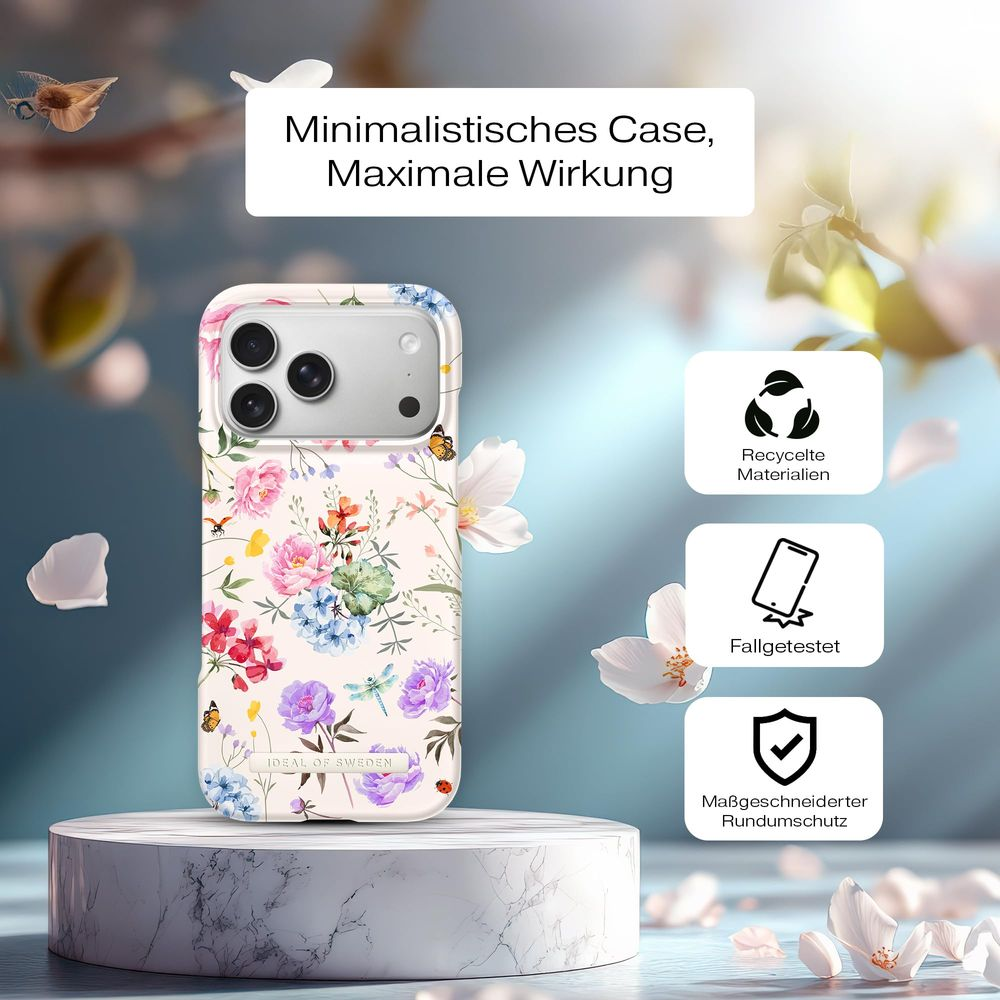 Blumenmuster Handyhülle auf Marmorsockel mit Symbolen für Recycling, Falltest und Schutz.