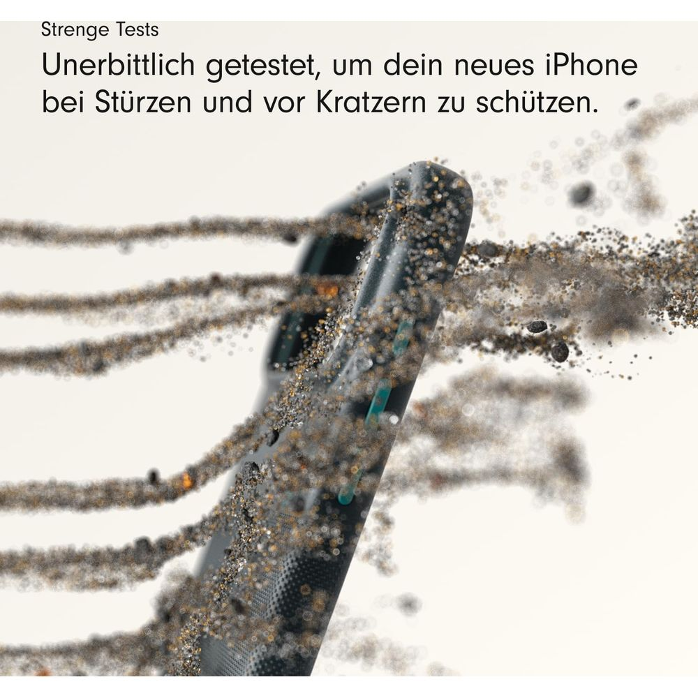 Czarny iPhone otoczony kurzem i gruzem, pokazujący test wytrzymałości.