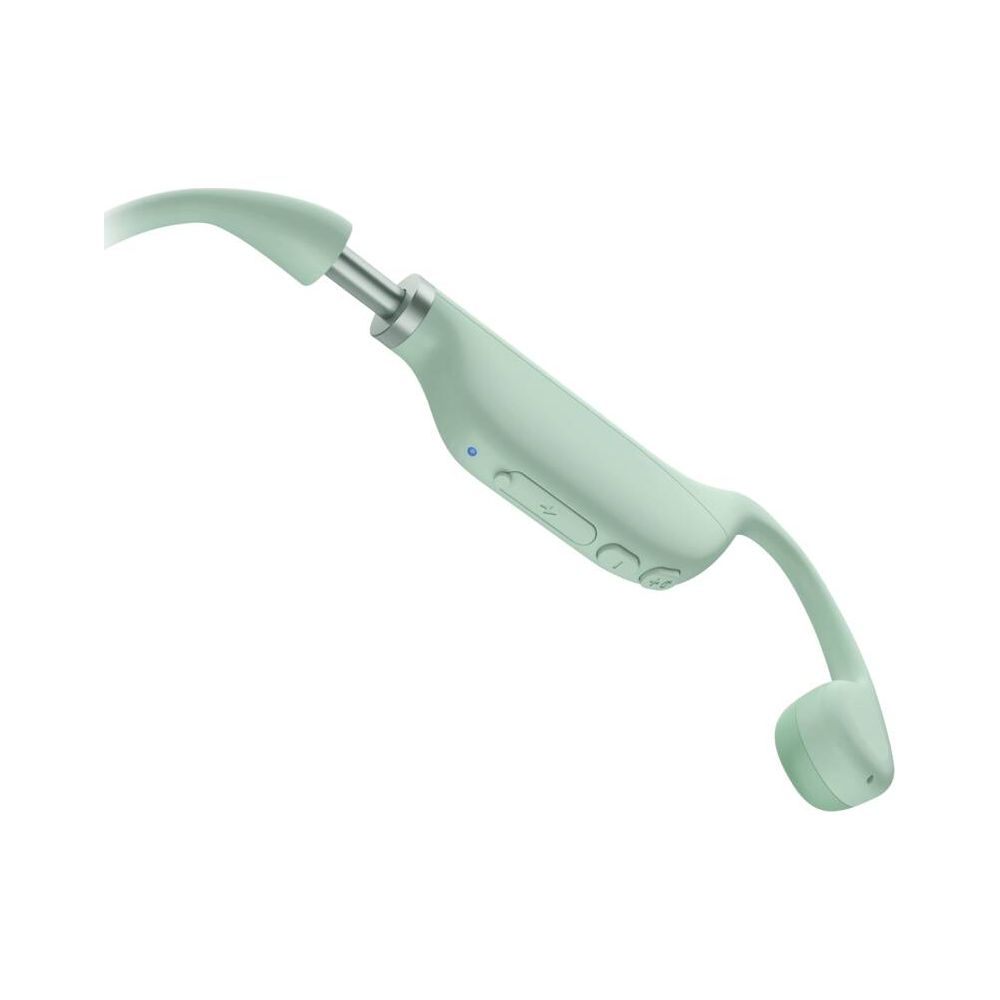 Primo piano di un auricolare wireless verde chiaro con pulsanti volume e accensione.