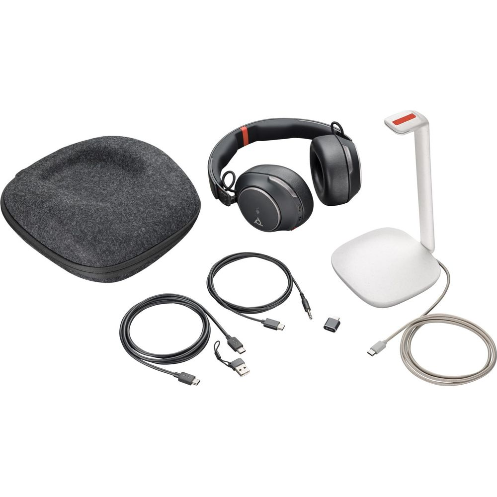 Headphones, charging cables, adapter, and charging stand on a white background.