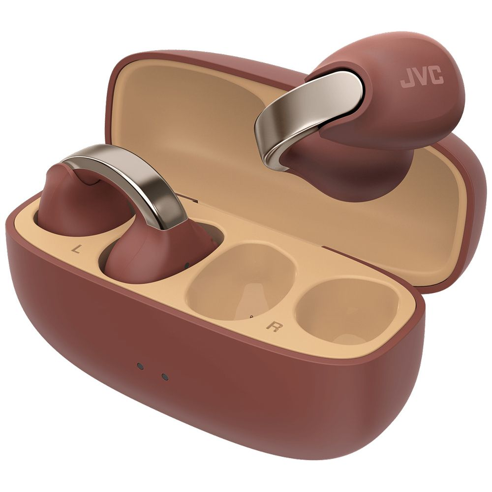 Brązowe słuchawki JVC z etui ładującym i srebrnymi akcentami.
