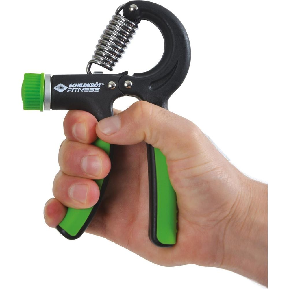 Mano che tiene un rafforza-presa nero e verde con molla metallica.