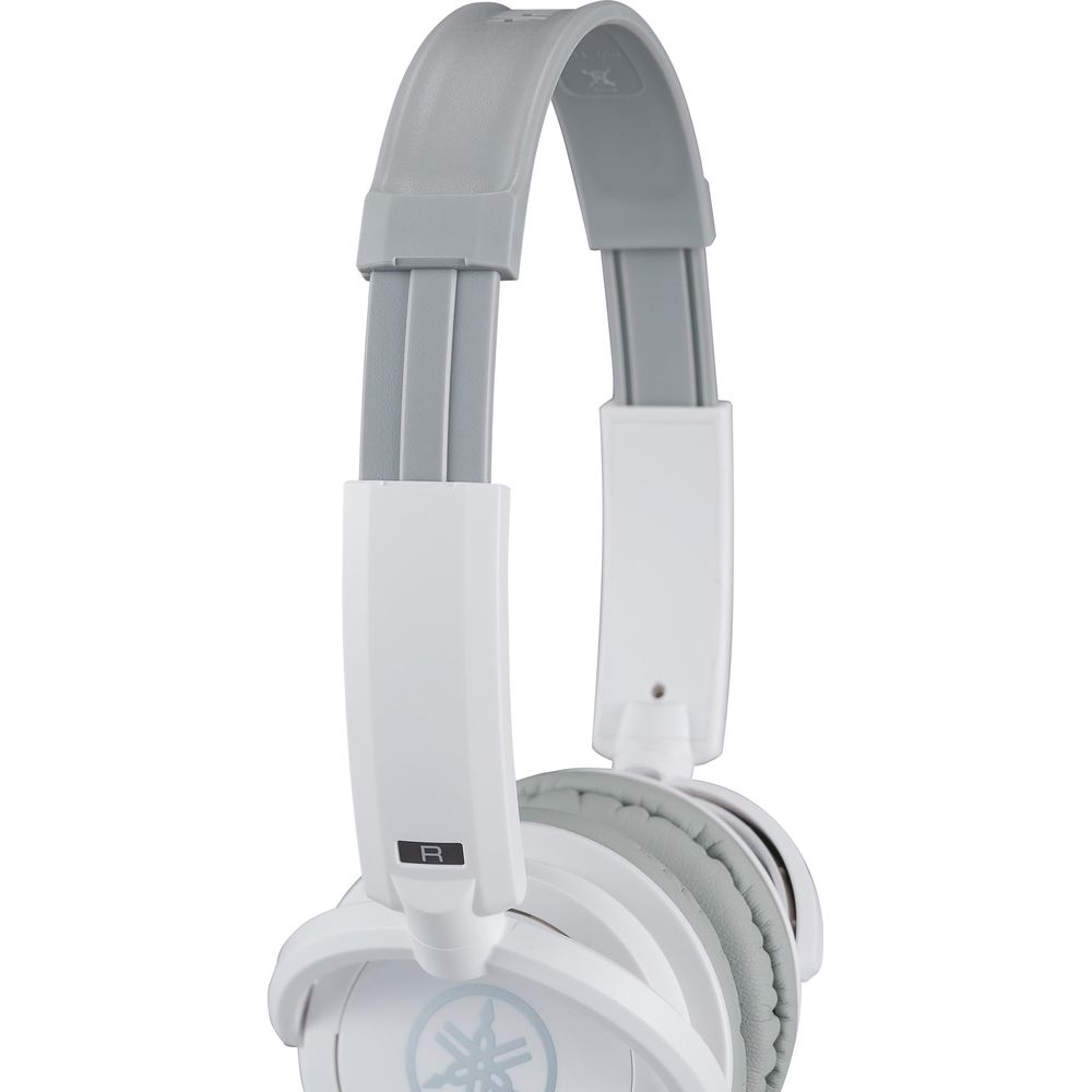 Casque blanc avec arceau et coussinets gris, logo visible.