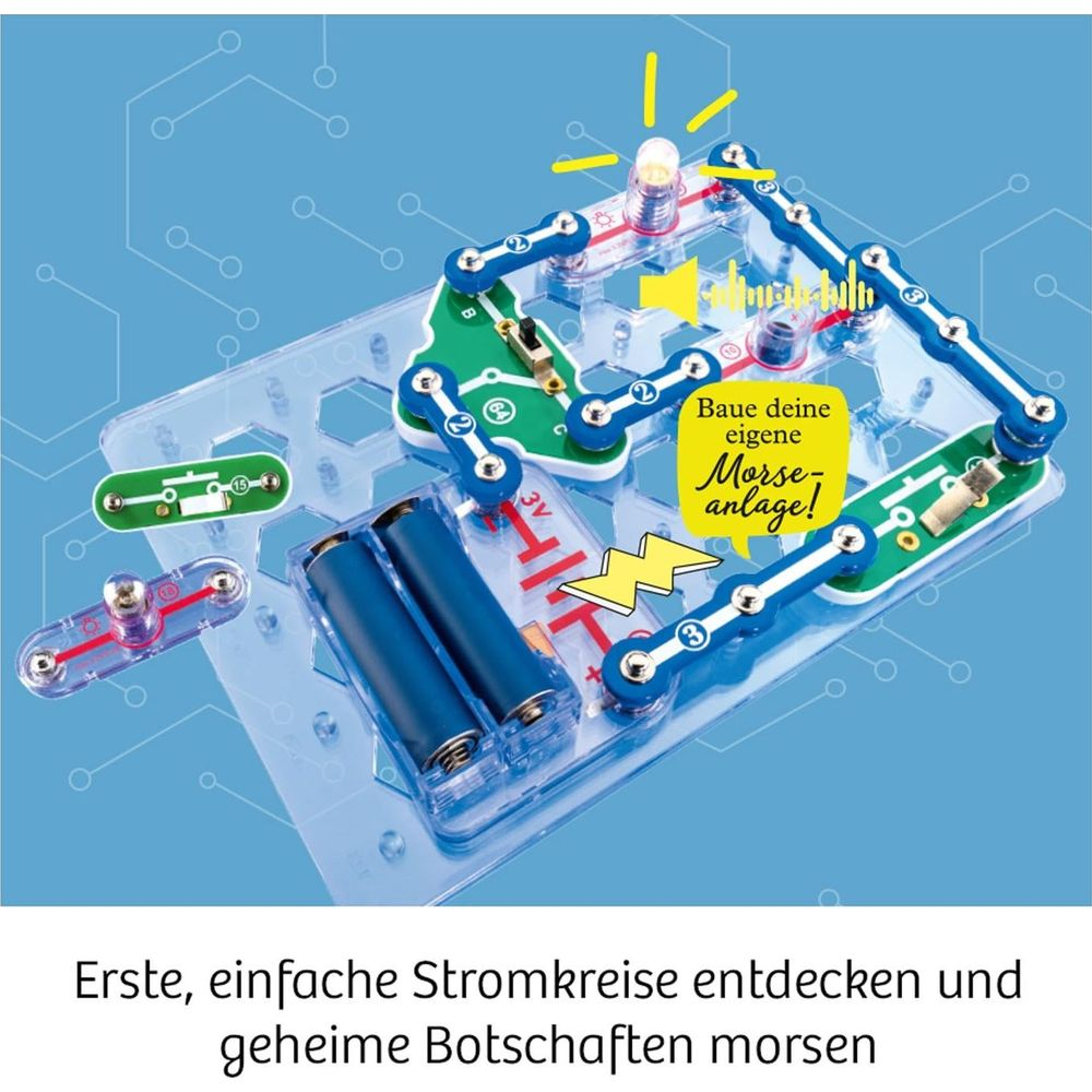 Elektronik-Baukasten mit Batterien, Glühbirne und Verbindungsstücken. Ein gelber Sprechblasen-Text erwähnt Morse-Anlage.