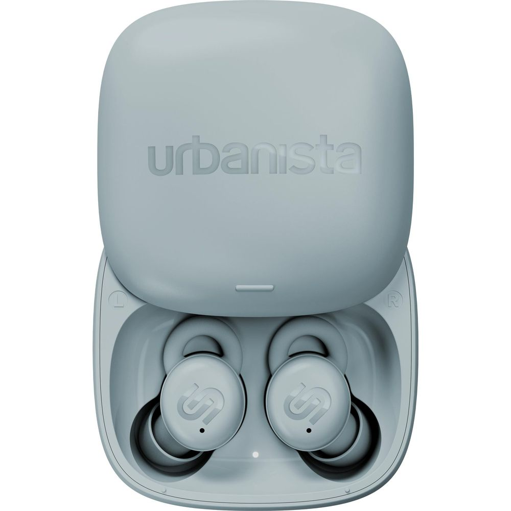 Szare słuchawki Urbanista w etui ładującym.