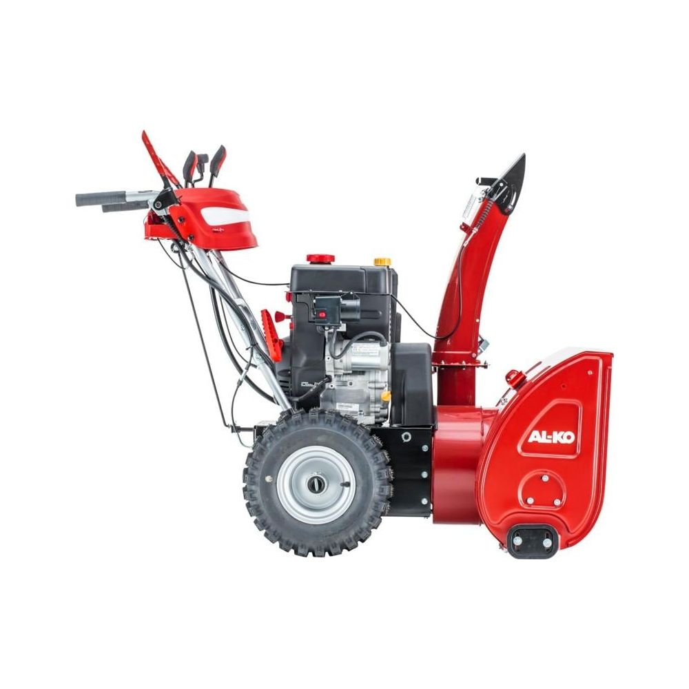 Ein roter Schneefräser mit schwarzem Motor und großem Reifen.