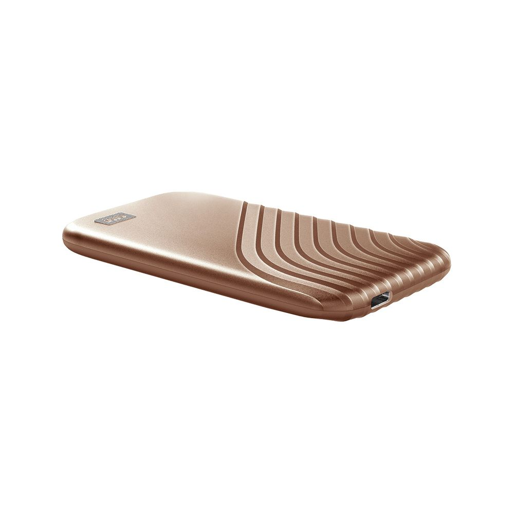 Un disque dur portable couleur bronze avec un design nervuré.