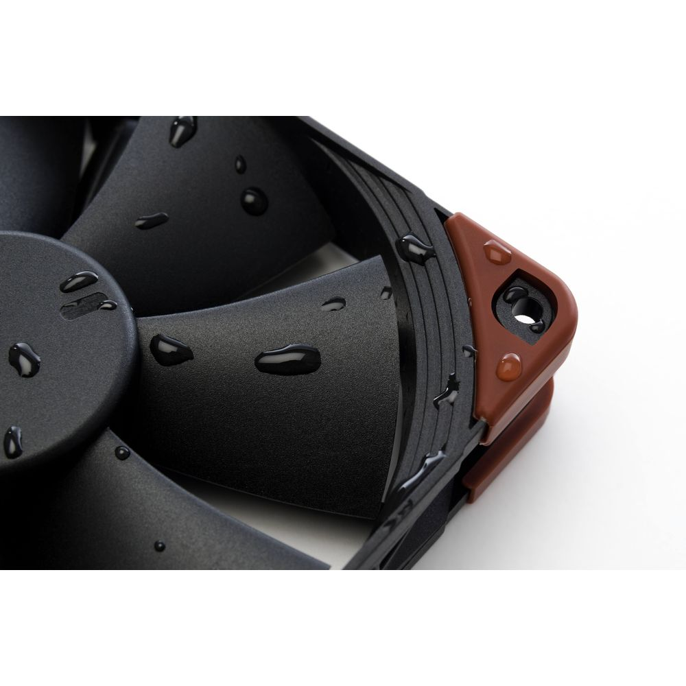 Black fan with water droplets on black blades and brown corners.
