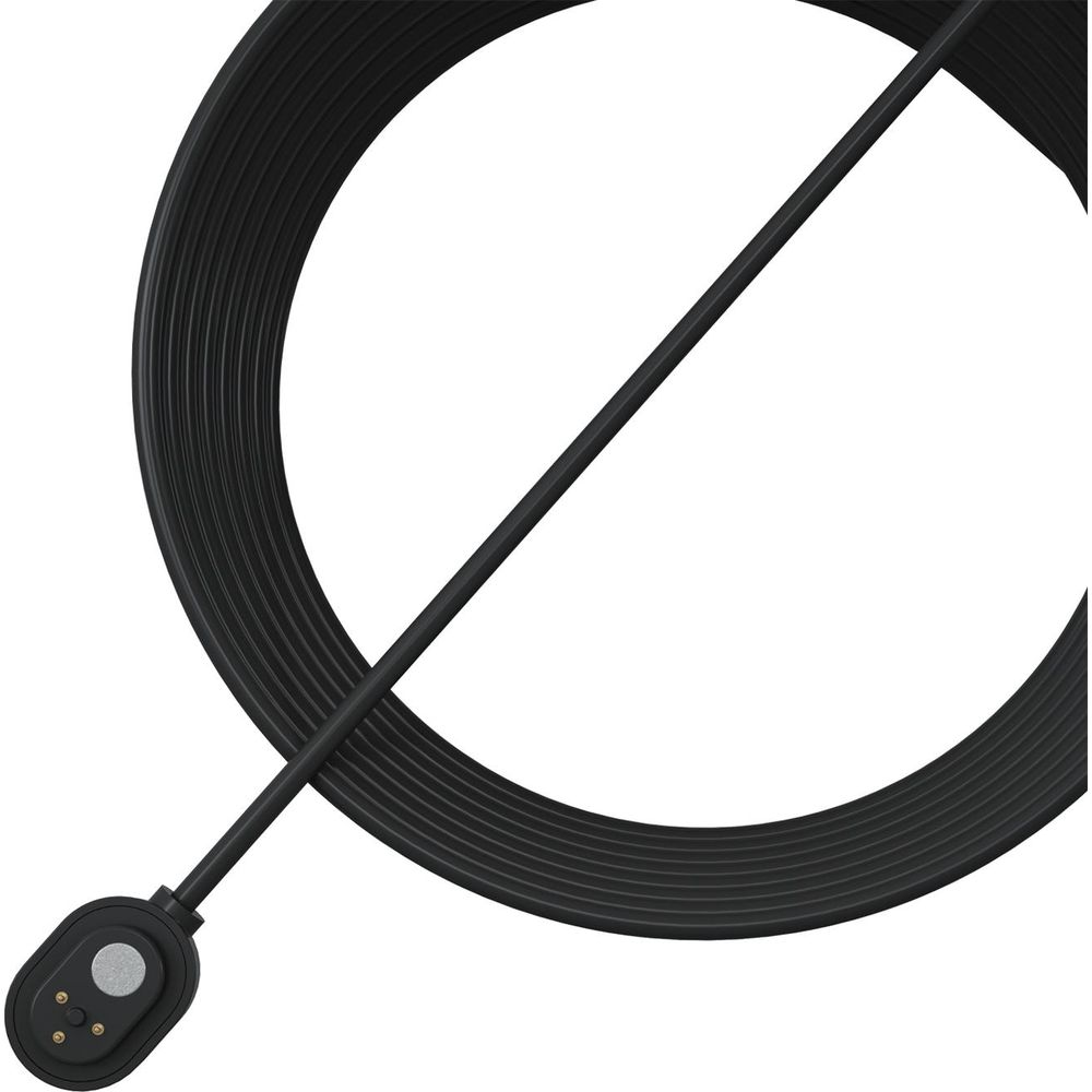 Un cavo di ricarica nero con connettore rotondo, avvolto attorno a un anello nero.