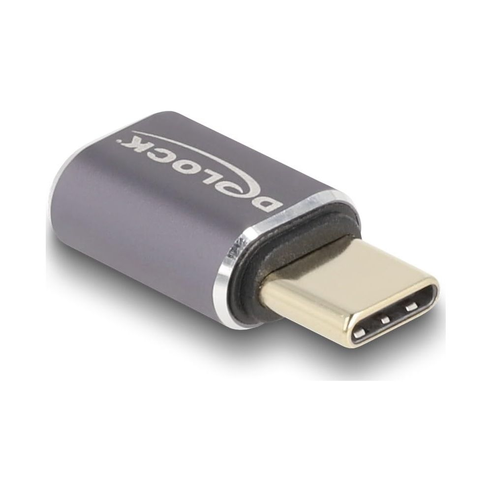Adattatore USB-C grigio con connettore dorato e logo. Pratico per device.
