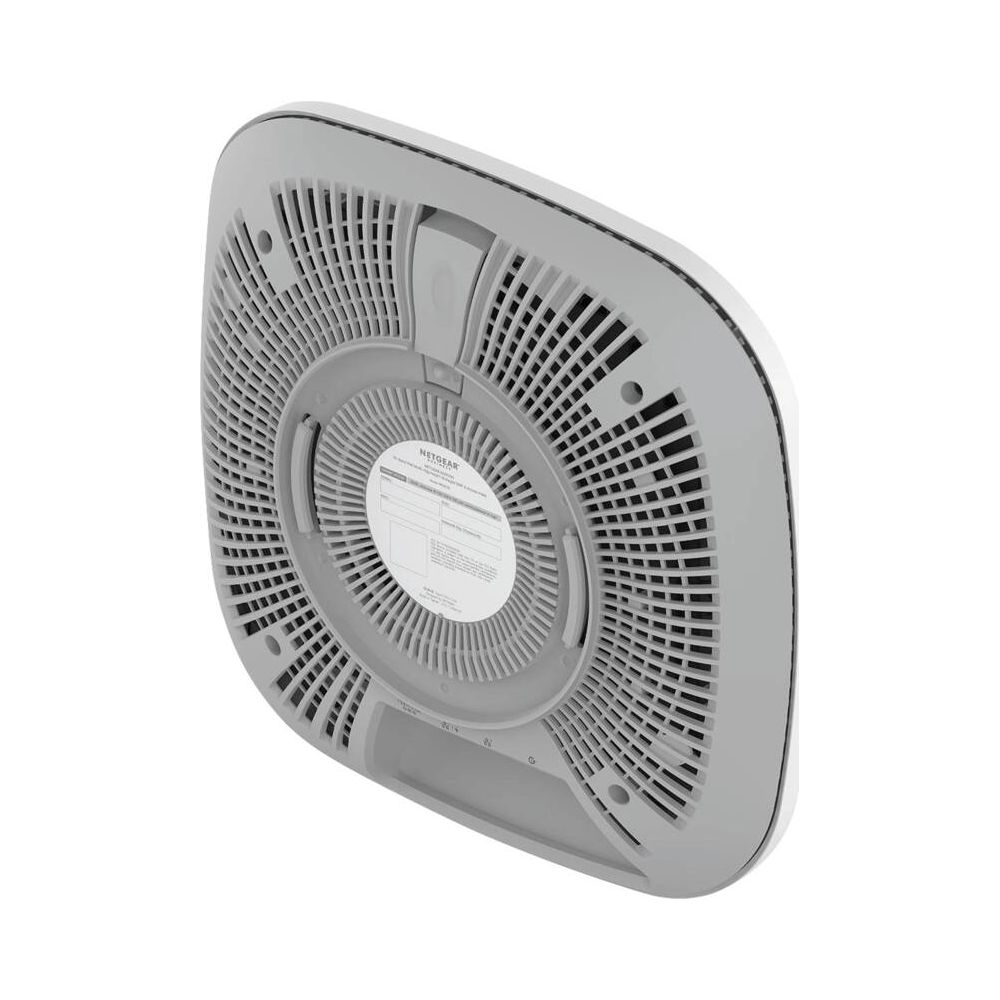 Spód szarego routera z otworami wentylacyjnymi i logo Netgear.