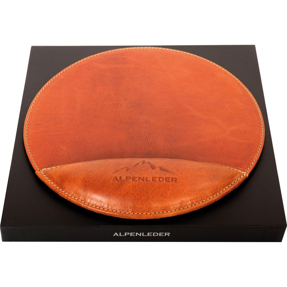 Tapis de souris en cuir marron avec repose-poignet sur boîte noire.
