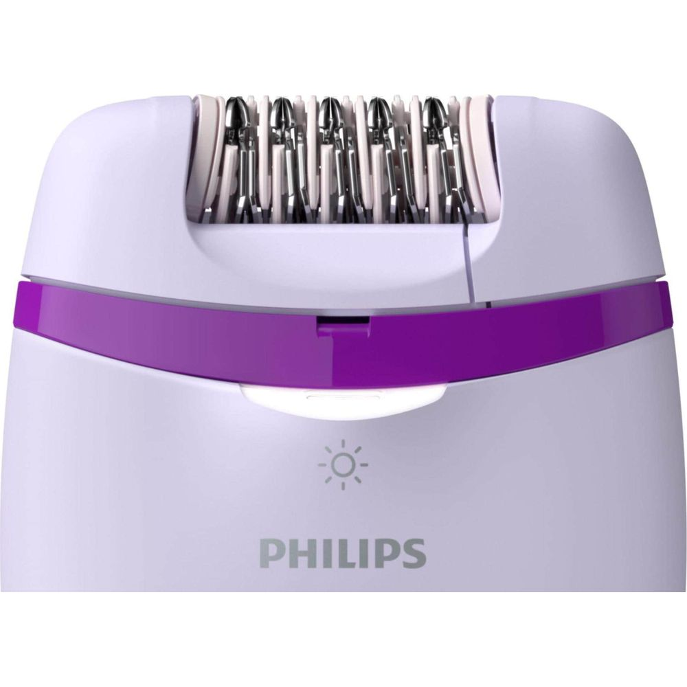 Fioletowy depilator Philips z srebrnymi pęsetami. Widok z bliska.