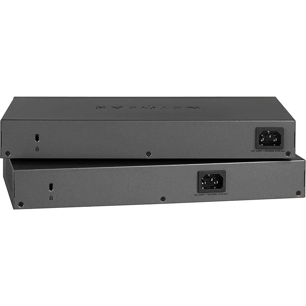 Dwa szare przełączniki sieciowe ułożone jeden na drugim z widocznymi portami z tyłu.