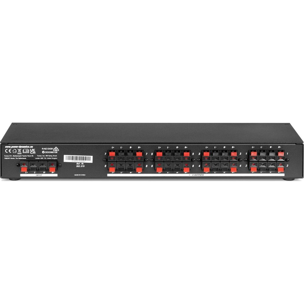 Dispositivo de audio negro con terminales rojos y negros, etiquetado con números.