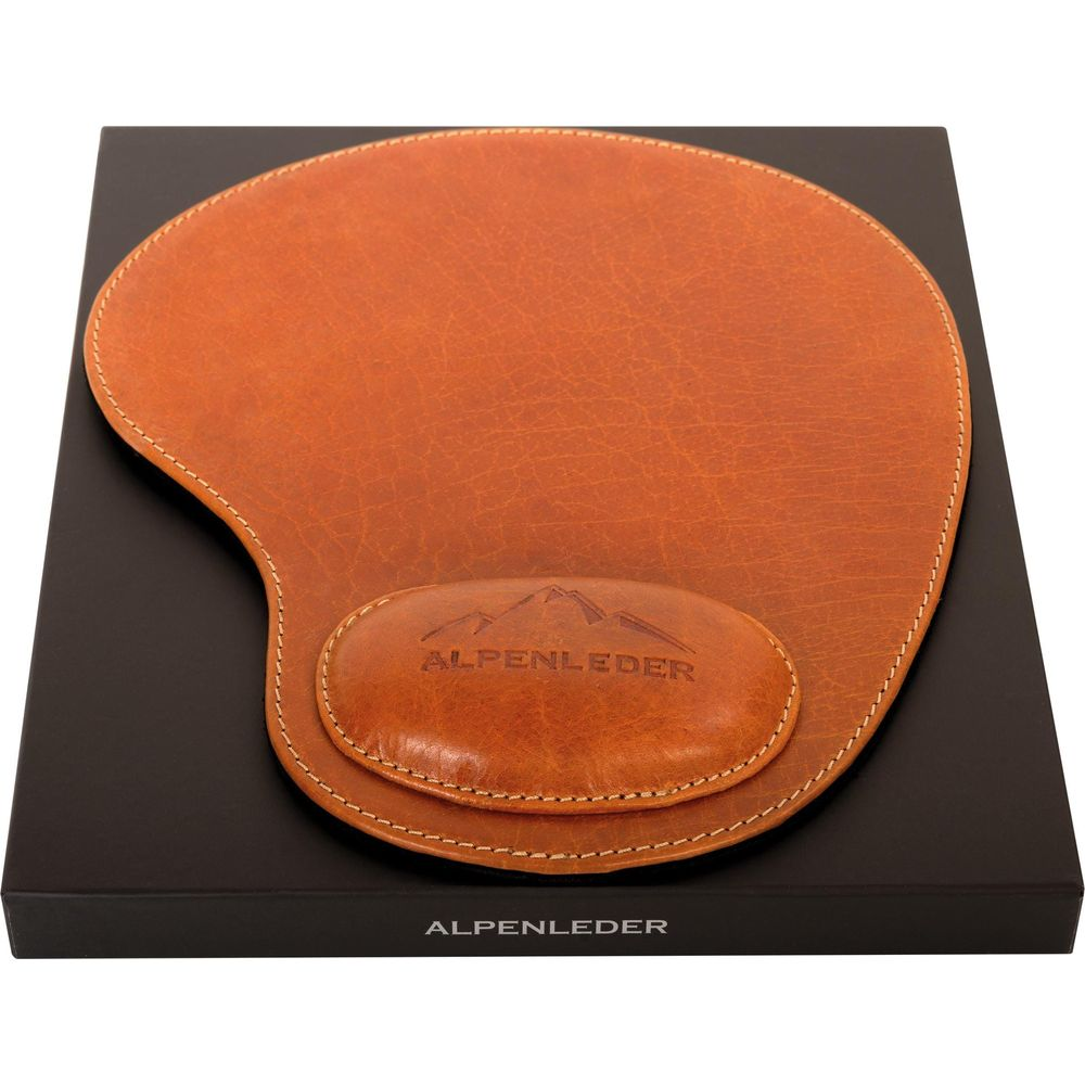 Tapis de souris en cuir marron avec repose-poignet sur boîte noire.