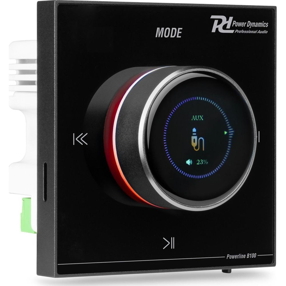 Panel de control negro con dial, pantalla muestra AUX, 23% de volumen.