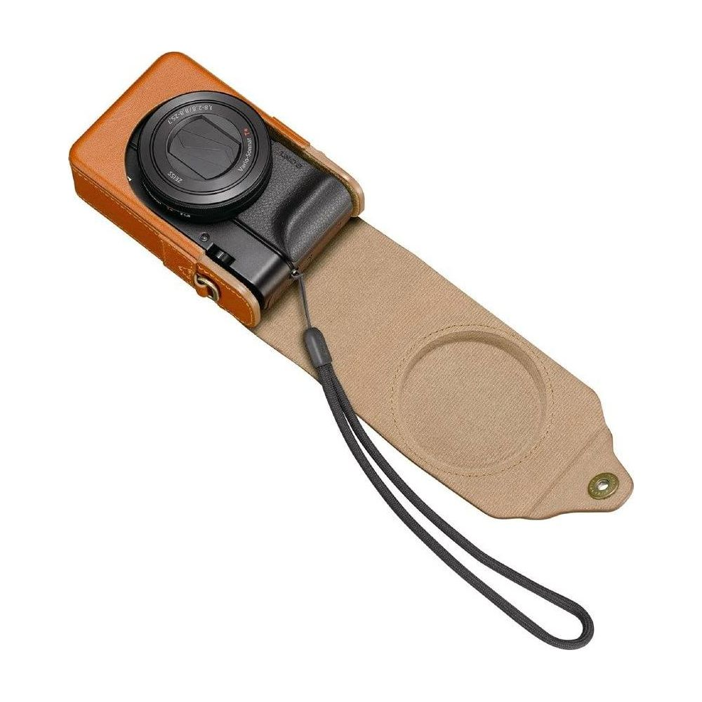 Una custodia in pelle marrone per fotocamera con cinturino.