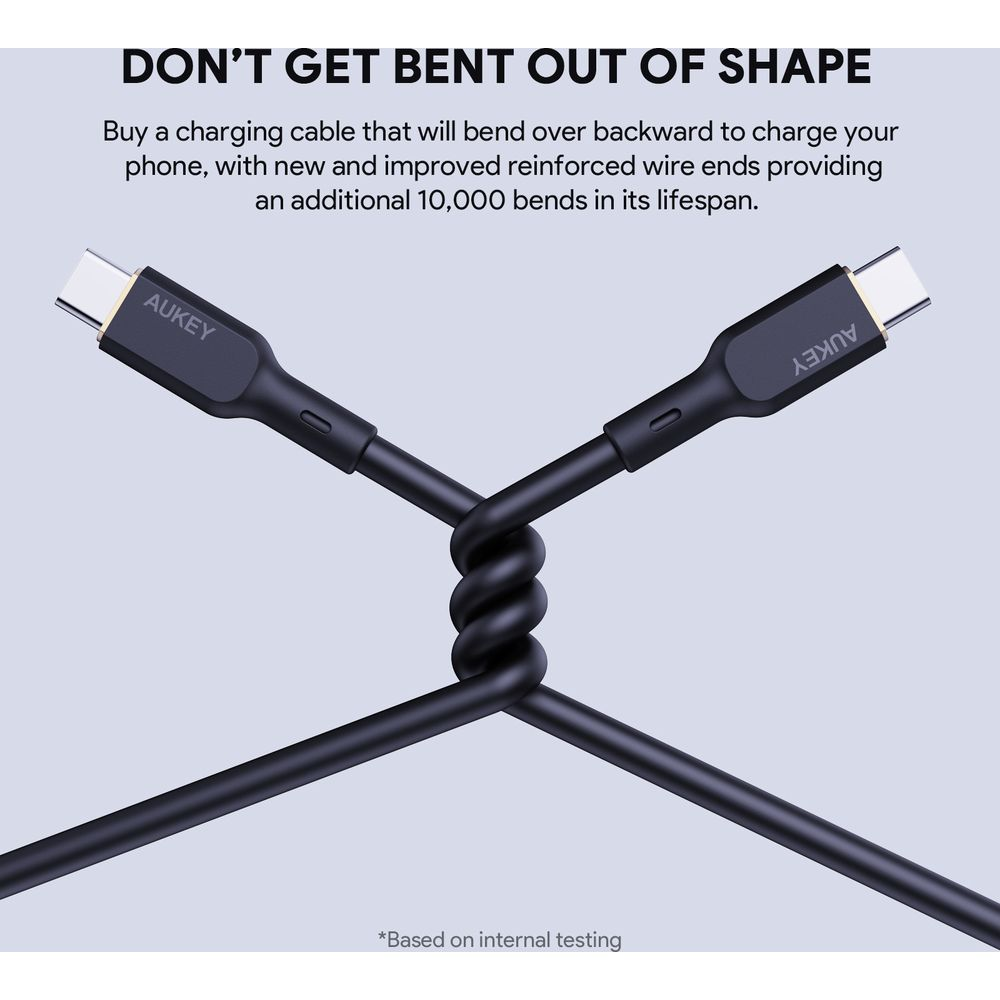 Czarny kabel USB-C AUKEY jest skręcony. Jest pokazany z hasłem reklamowym.