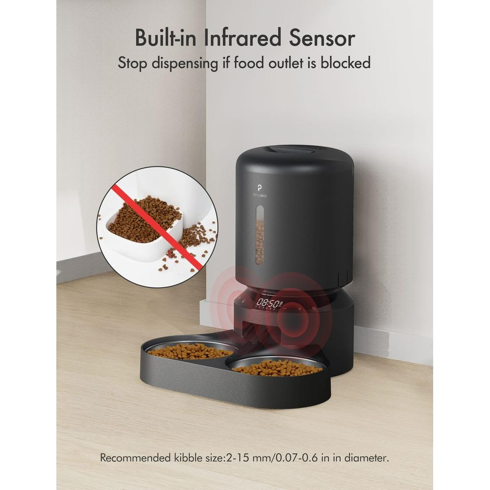 Black pet feeder with dual bowls and infrared sensor. Displays 08:50.