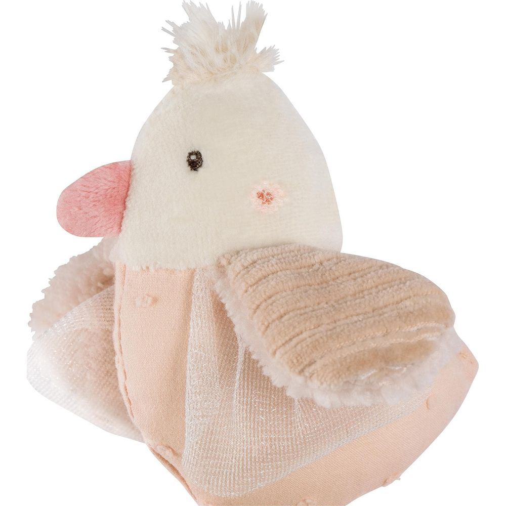 Une peluche douce et blanche avec un bec et des ailes roses sur fond blanc.