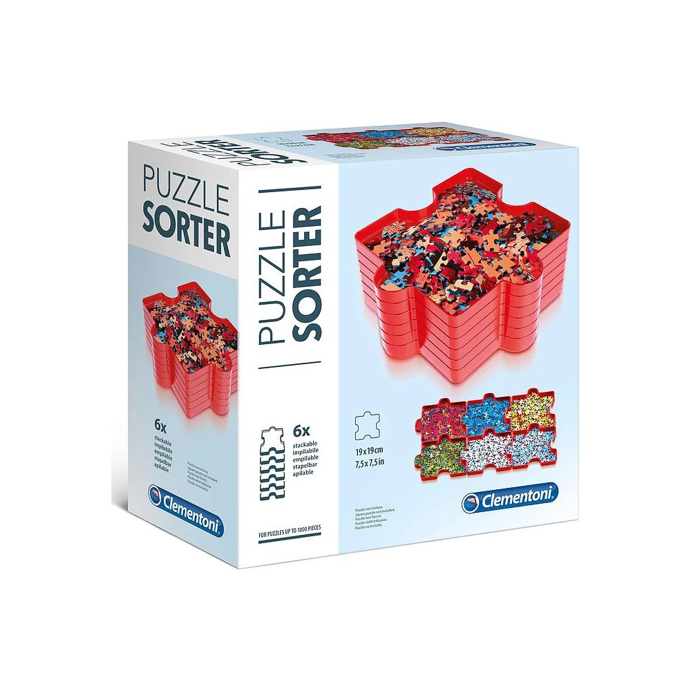 Roter Puzzle-Sortierer mit vielen Puzzleteilen gefüllt, auf einem Karton.