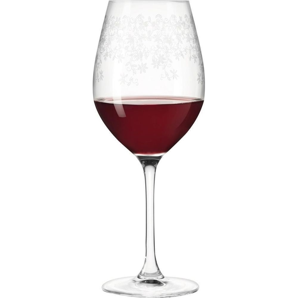 Ein Weinglas mit rotem Wein, verziert mit floralen Mustern.