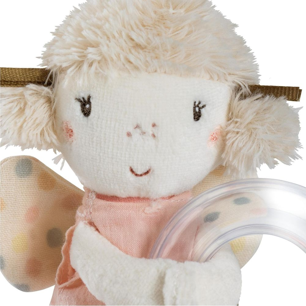 Une peluche avec un visage blanc, des joues roses et un sourire.