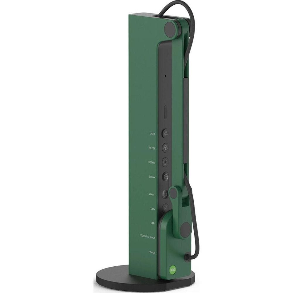 Dispositivo verde con controlli e cavo su base nera.