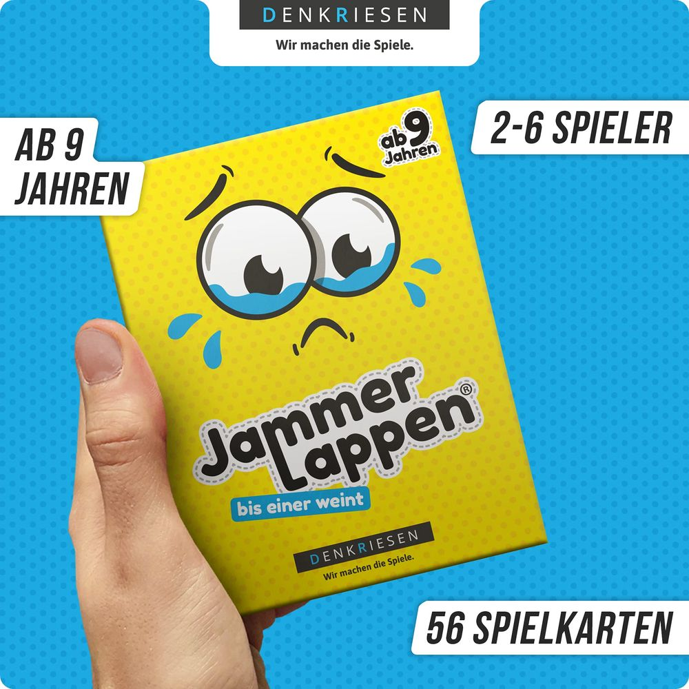 Eine Hand hält eine gelbe Spielbox mit traurigem Gesicht. Für 2-6 Spieler ab 9 J.