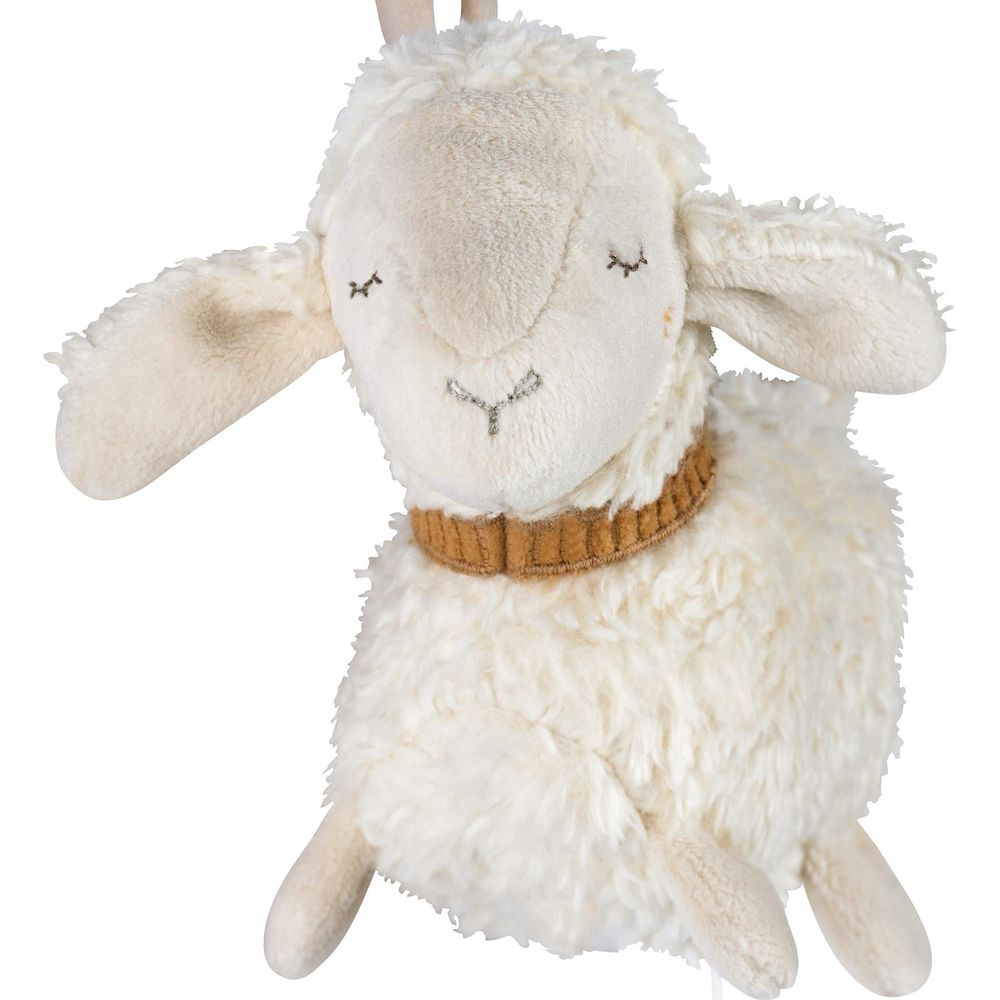 Un peluche di pecora bianco e soffice con occhi chiusi e un collare marrone.