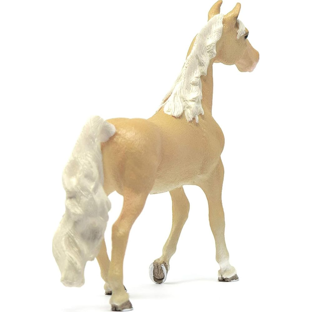 Jasnobrązowy koń-zabawka z białą grzywą i ogonem.