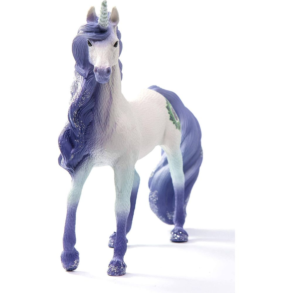 Biała figurka jednorożca z fioletową grzywą i ogonem, błyszczącymi kopytami.
