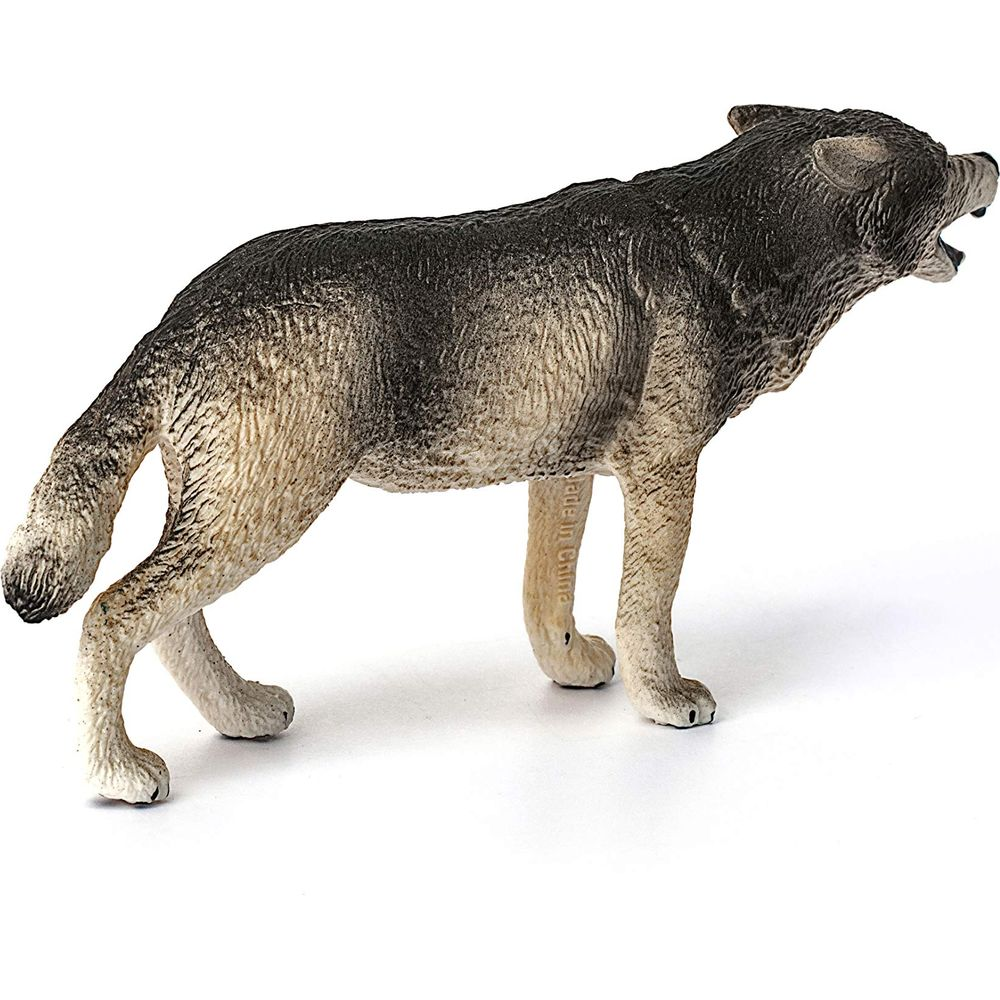 Szara figurka zabawkowego wilka z otwartym pyskiem na białym tle.