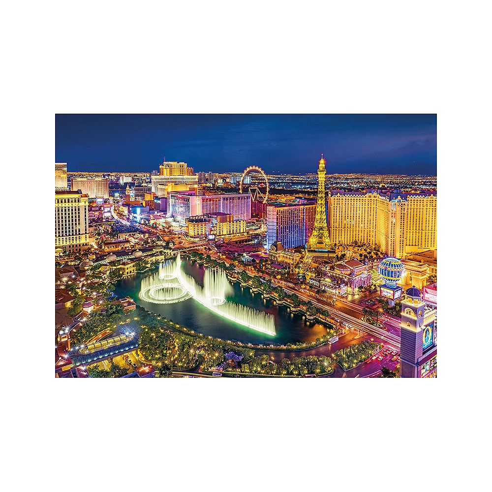 Panorama Las Vegas nocą z Wieżą Eiffla, diabelskim młynem i fontannami Bellagio.