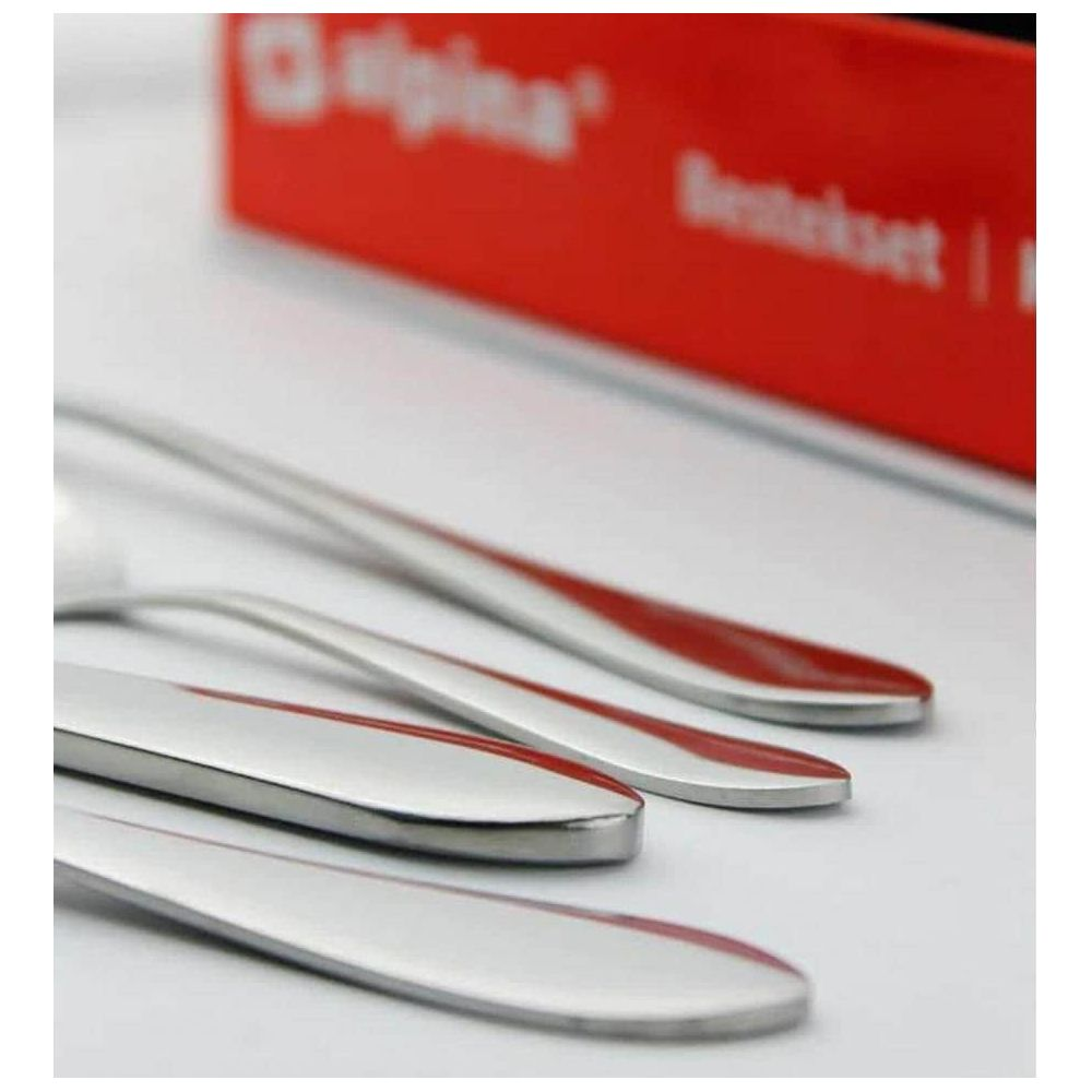 Silver cutlery with red accents lies on a white background.