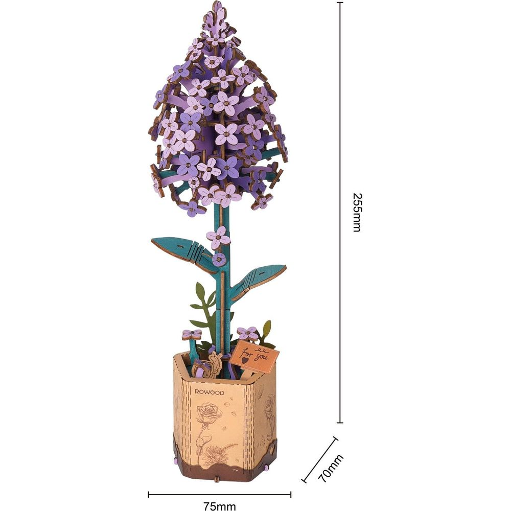 Drewniany model fioletowego kwiatu w doniczce, wymiary 255x75x70mm.