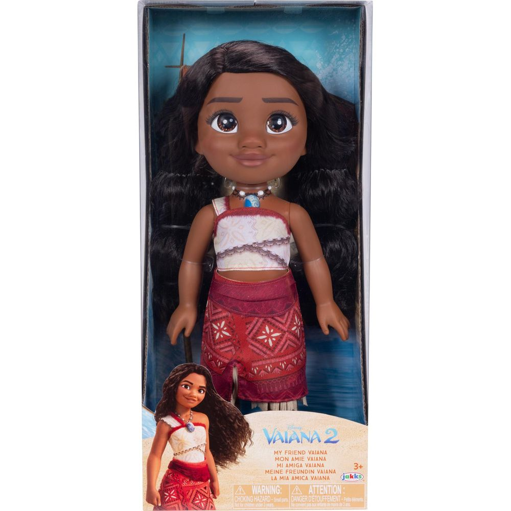 Muñeca Moana en caja, con texto 'Vaiana 2' y advertencias.