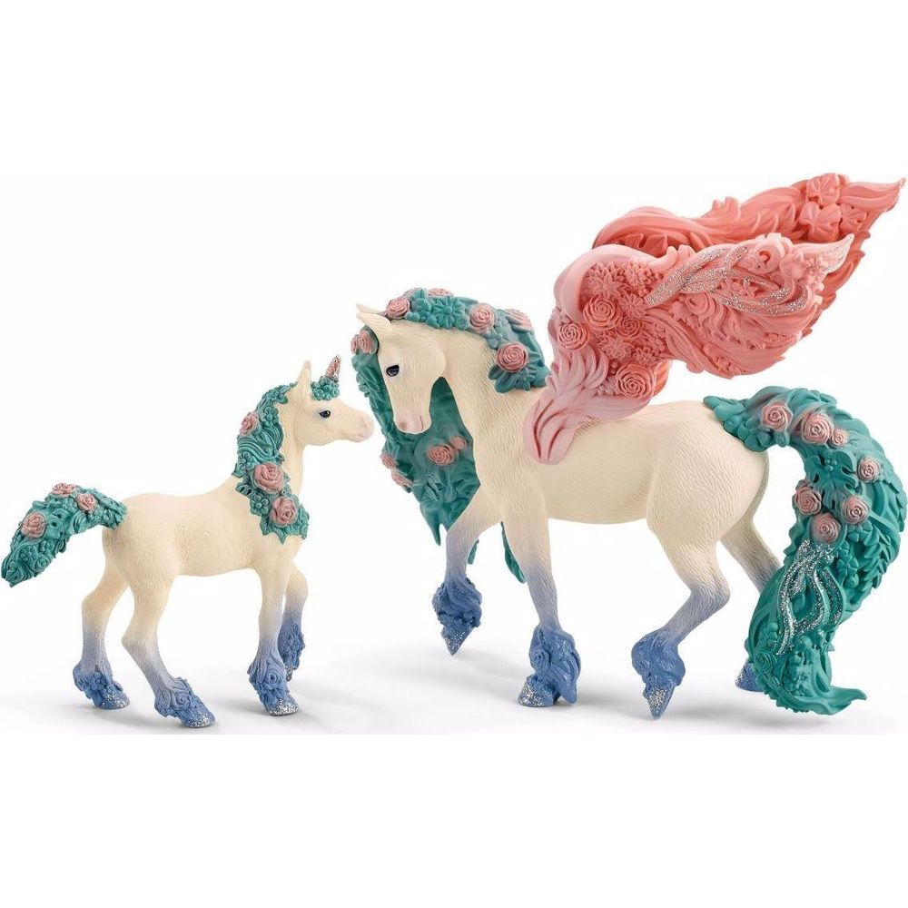 Zwei Einhornfiguren, eine groß mit Flügeln, mit blauen und rosa Akzenten.