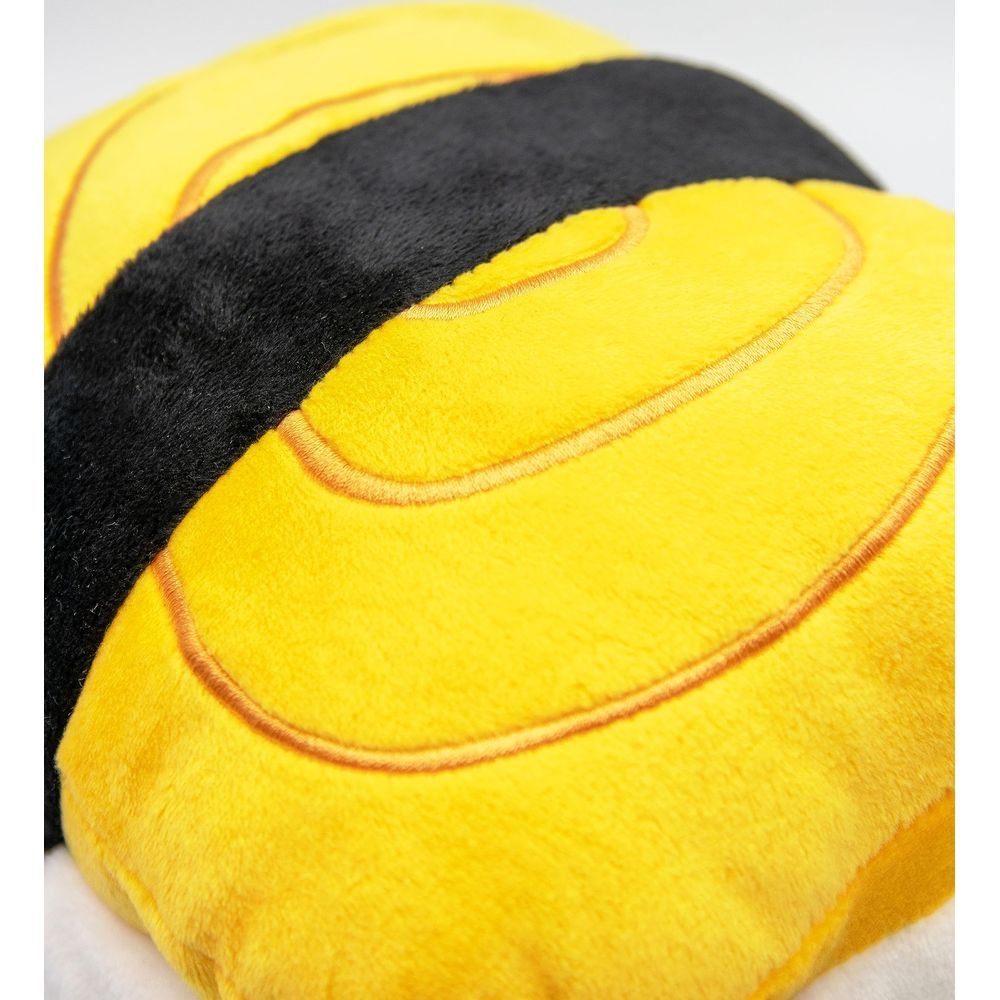 Un cuscino di peluche giallo e nero a forma di ape.
