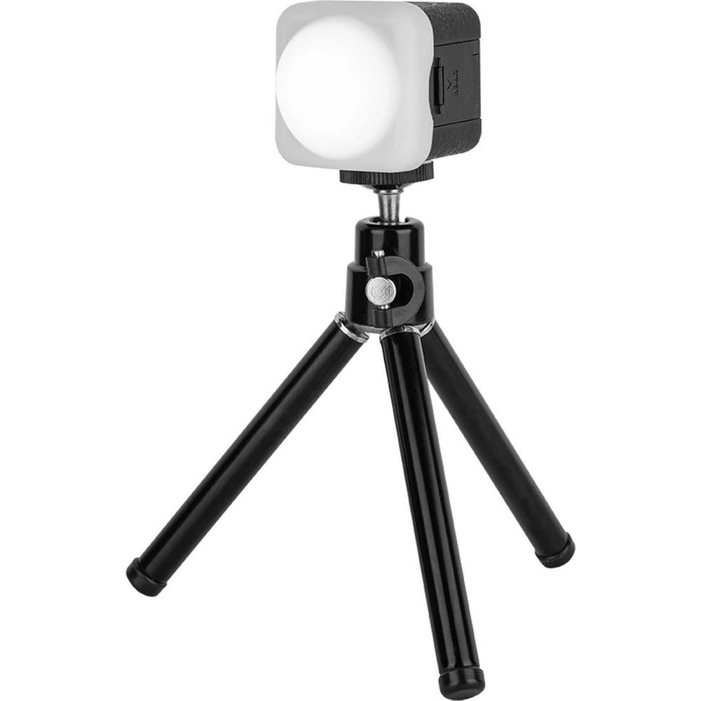 Compact LED light on a black mini tripod.