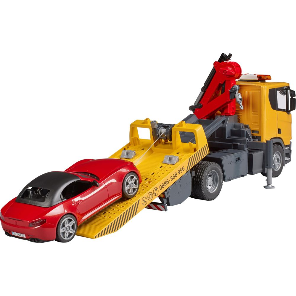 Ein roter Sportwagen wird auf einen gelben Abschleppwagen mit rotem Kran geladen.