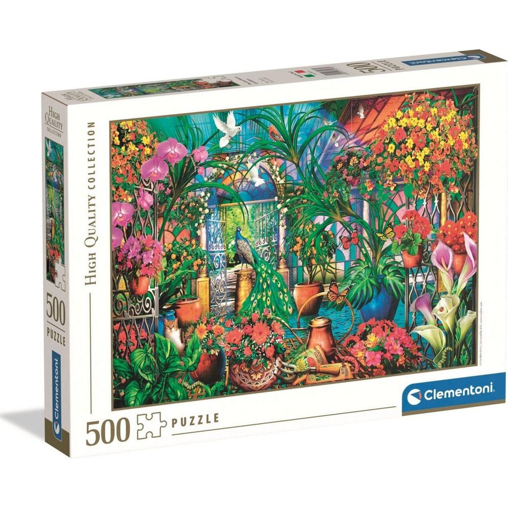 Eine 500-teilige Puzzlebox zeigt ein üppiges Gewächshaus mit Pfau, Blumen, Vögeln und Schmetterlingen.