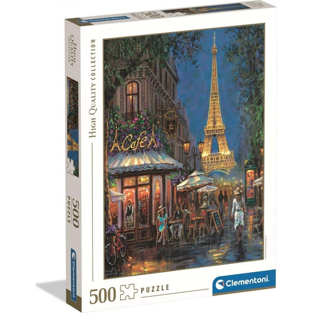Nachts ein Pariser Café mit Eiffelturm im Hintergrund.